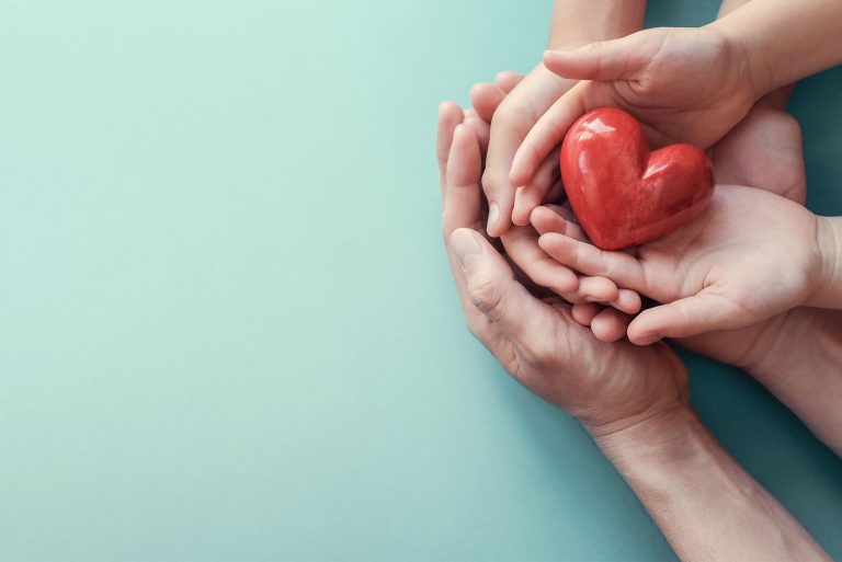 hands holding a heart